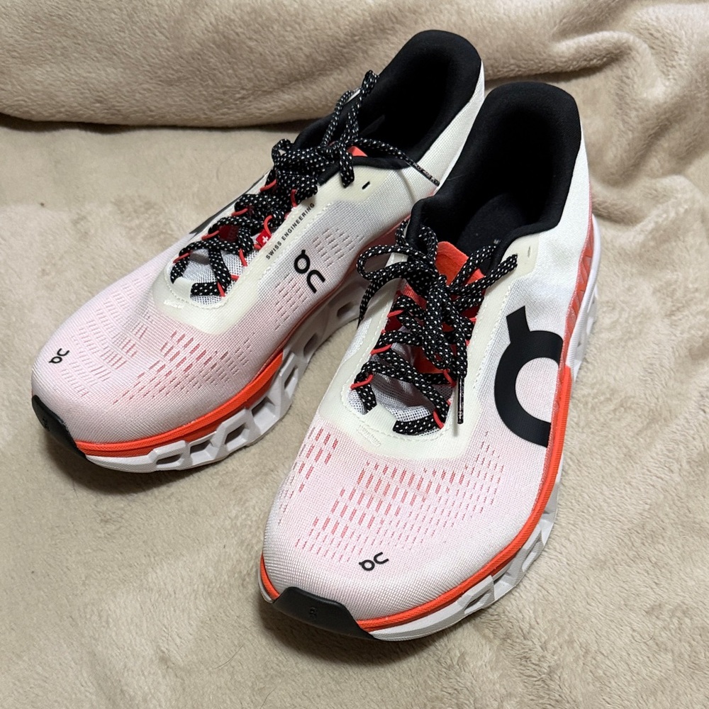 On Running Orange, Black and White Athletic Shoes